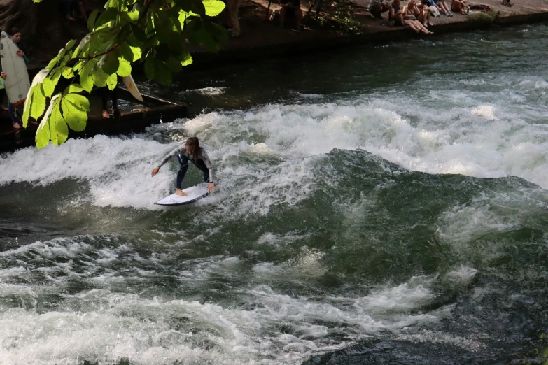 a surfer is riding on a wave in the water