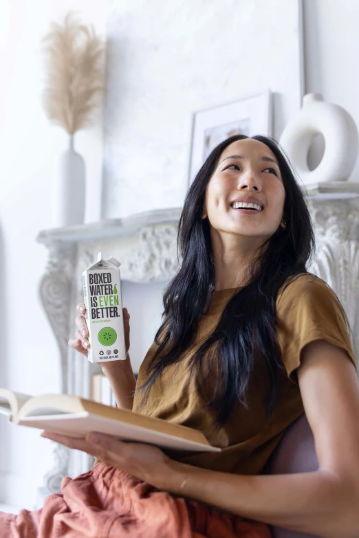 a woman holding a packet of seeds on her lap