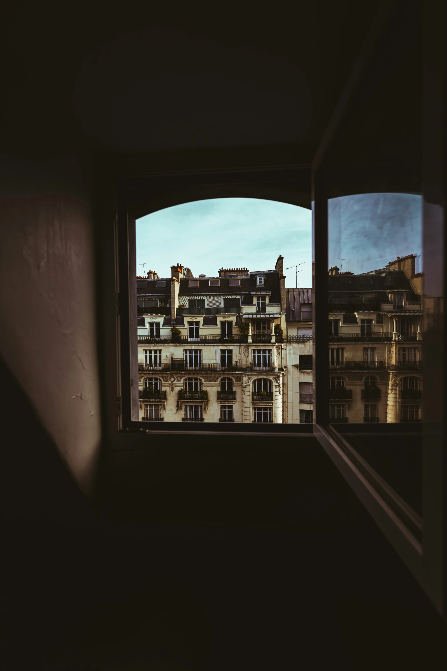 a view out of a window into a cityscape