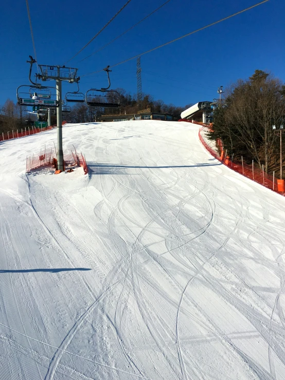 some skies that are sitting on a slope