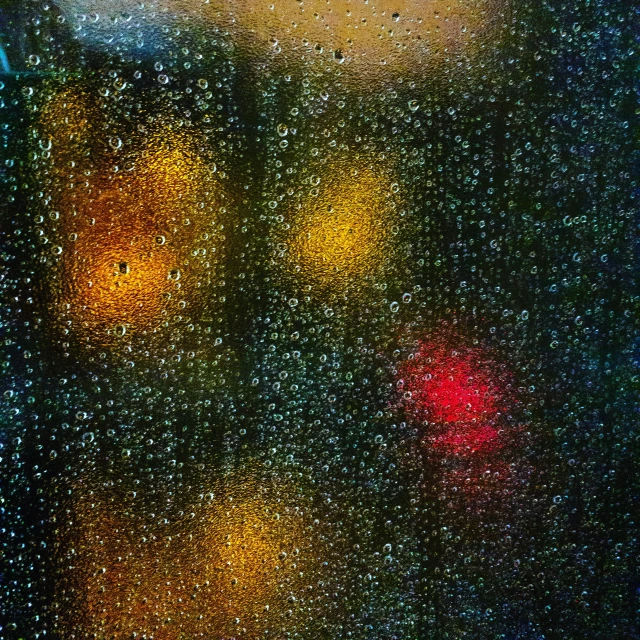 a close up image of the traffic lights on the window