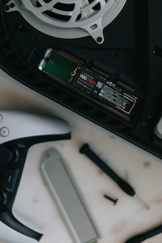 various electronics including a keyboard and mouse on a table