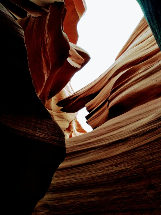 a cliff that appears to be shaped by water and sand