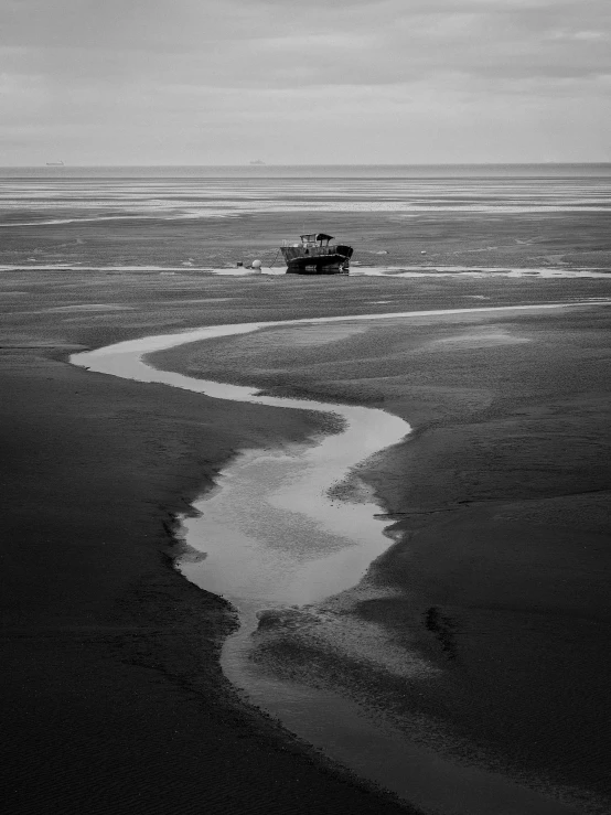 a black and white image of an ocean shore