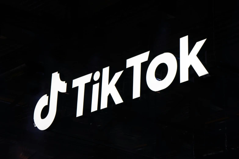 a black and white po of the logo for tik tok