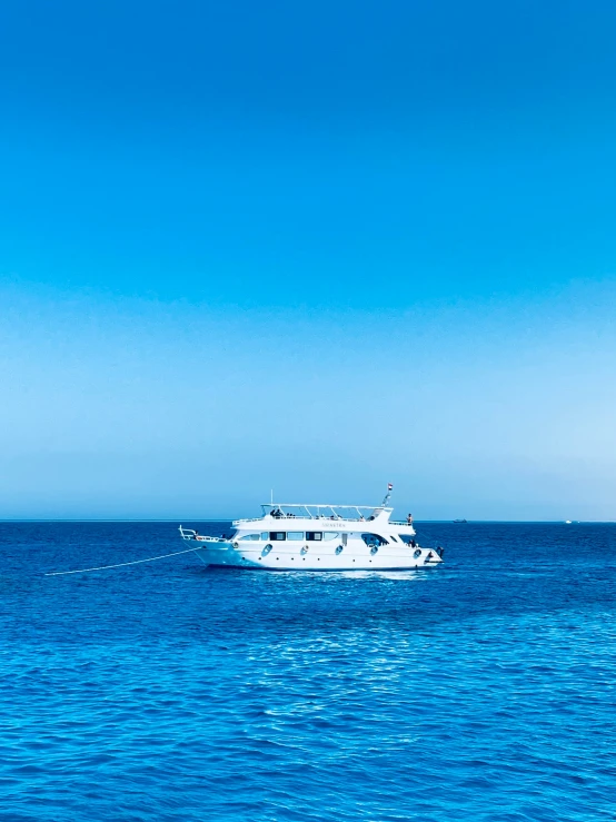 a large white boat is on the water