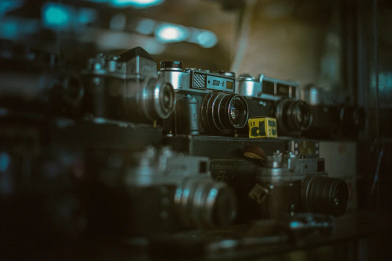 some cameras on top of each other in a room