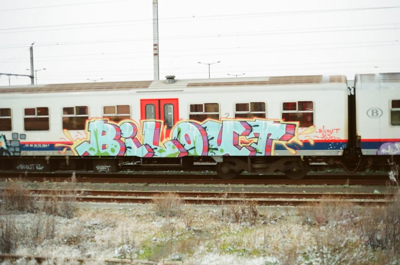 graffiti adorns the side of a train car