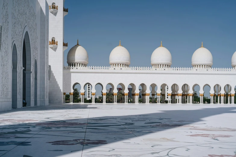 a view of a large building with several domes