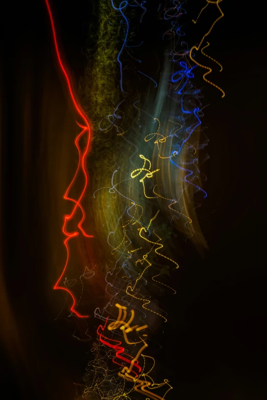 a long exposure pograph of an abstract painting of colorful lights