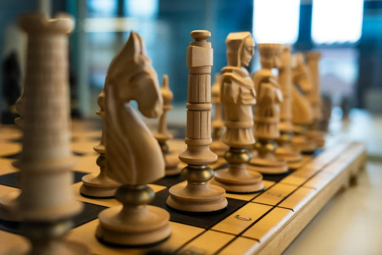 an chess board is shown with several wooden pieces