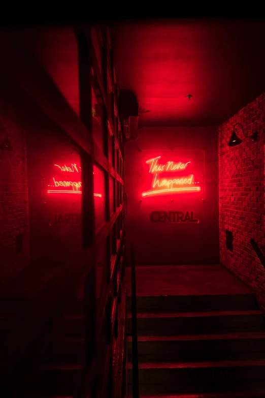 the hallway has neon signage all over it