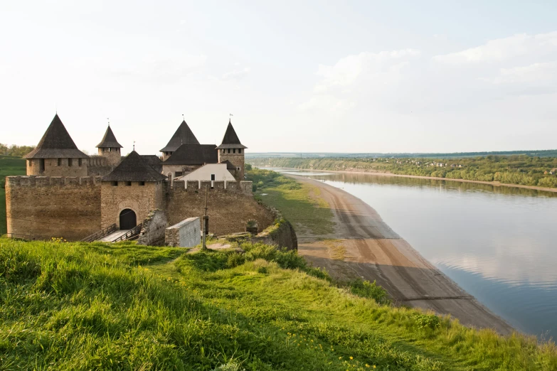 a scenic castle overlooks the river below