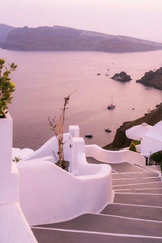 the stairs lead up to a large body of water