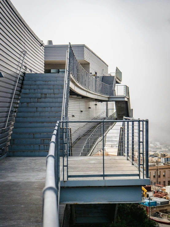 a long metal pipe is on the bottom of some steps