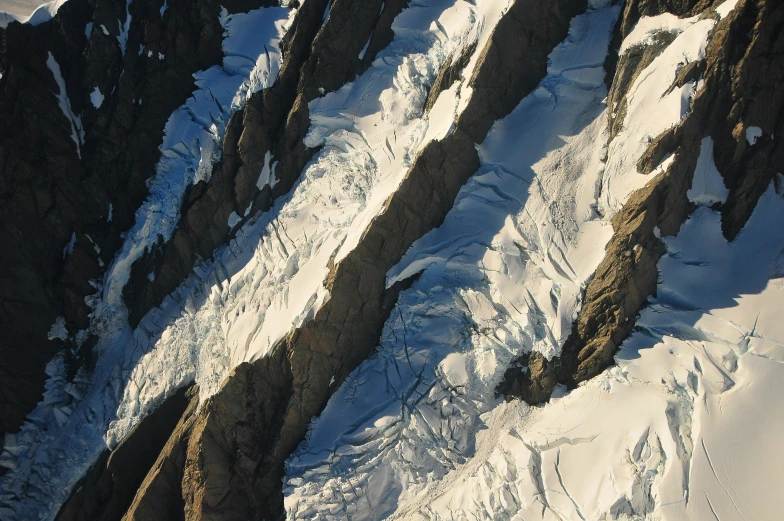 the top of a mountain covered in snow