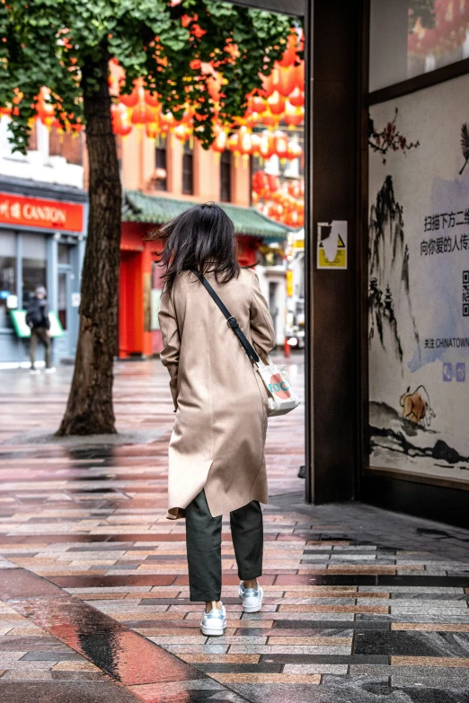 woman with an umbrella walking through the rain