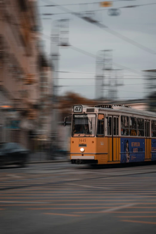 a city bus moving on the street at night