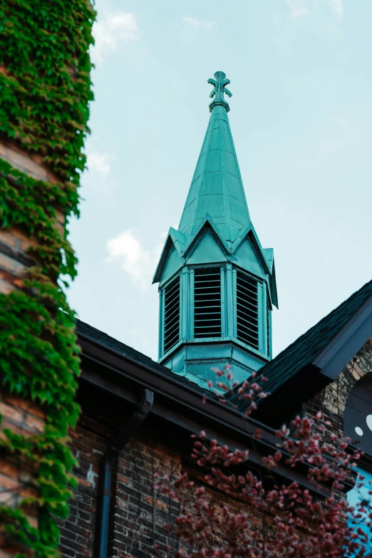 a building with an arched steeple is in front of a blue sky