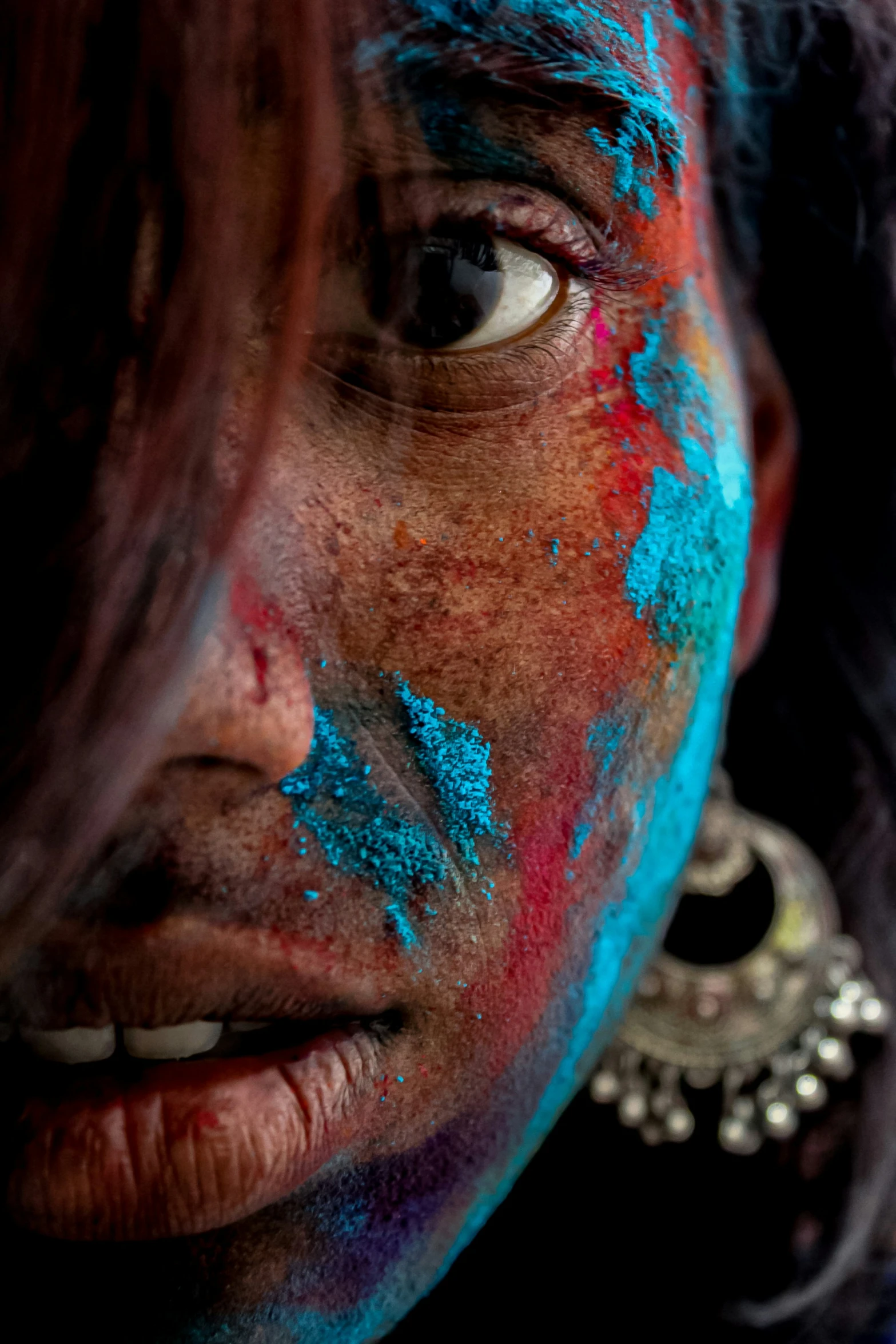 an image of a woman with different colored makeup