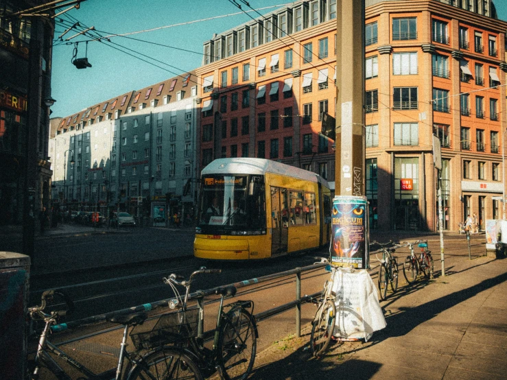 a cable car sits next to a bike rack