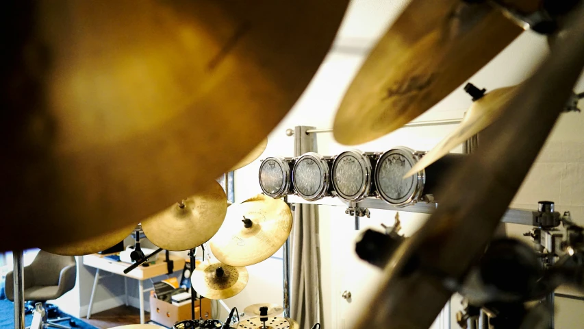 a bunch of drums that are on the wall