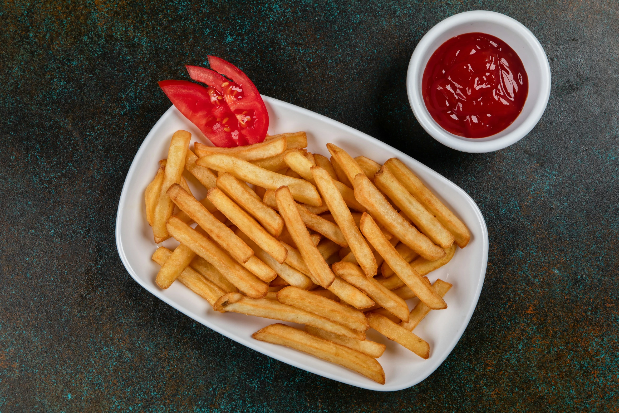 the french fries are on a paper plate