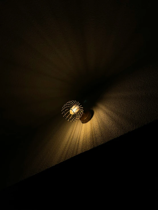 the corner of a ceiling light in a dimly lit room