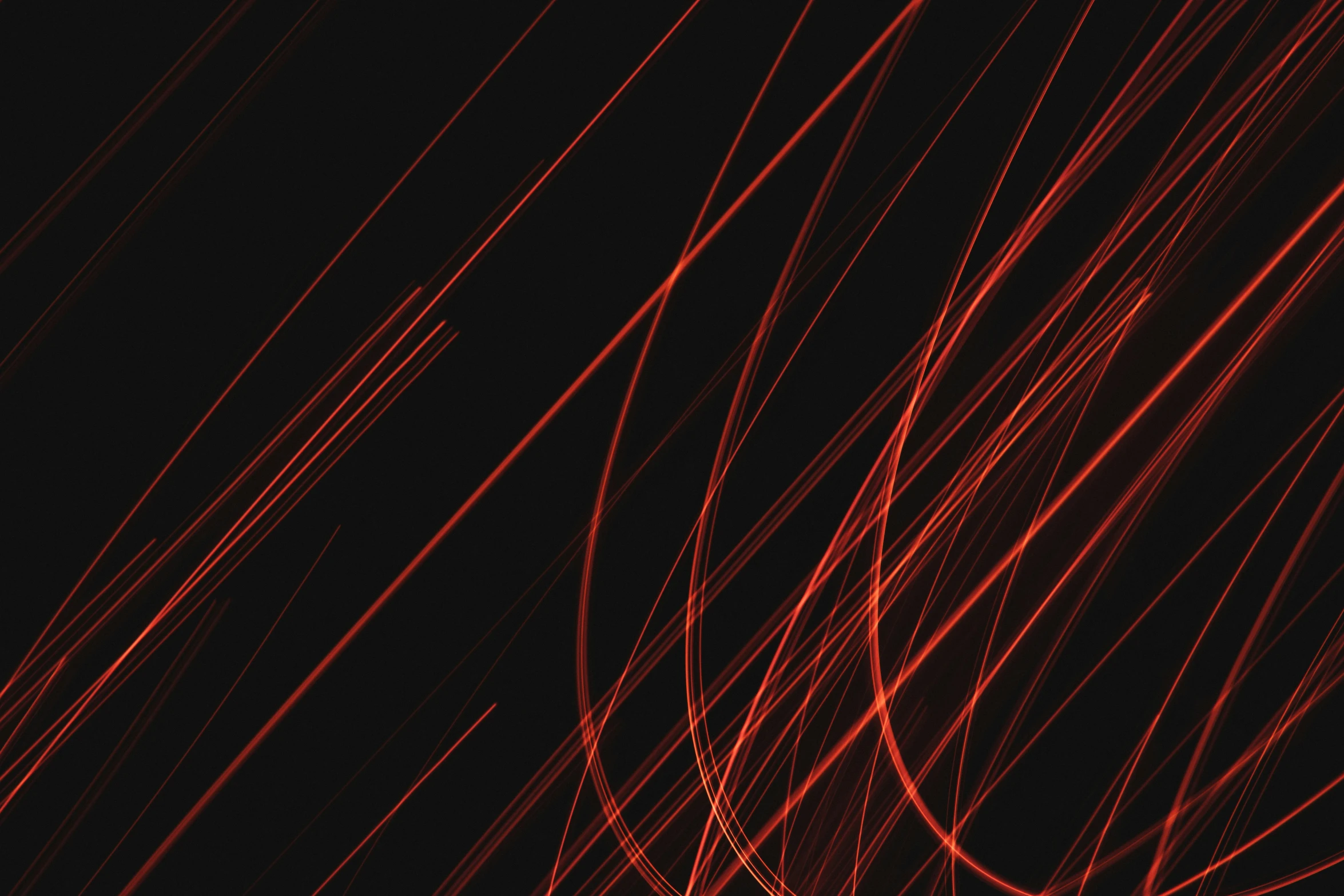 some very bright red lines are moving along the dark background