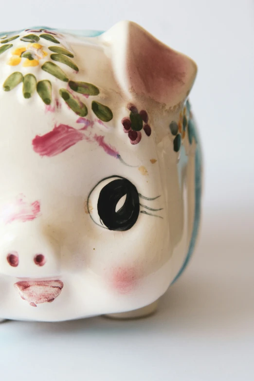 a close up of a little ceramic pig