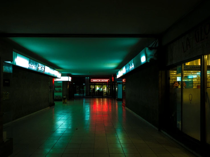 the floor in an empty building is lit by bright lights