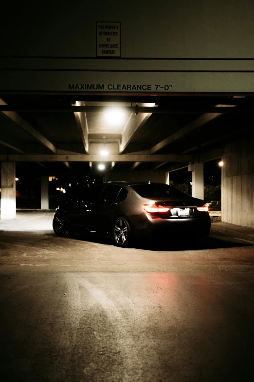 a car parked in the parking garage at night