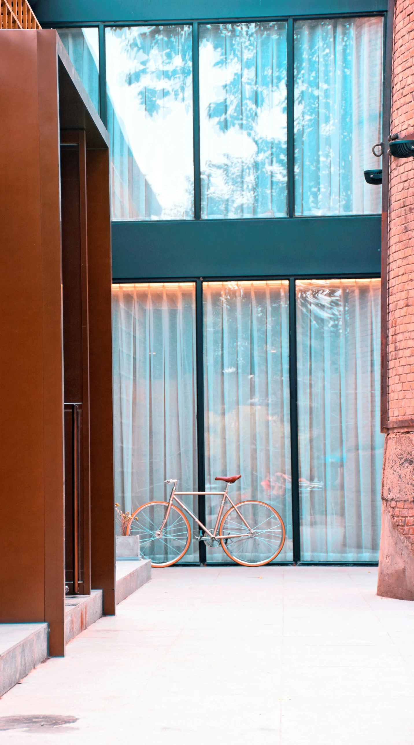 there is a bike that is parked near the window