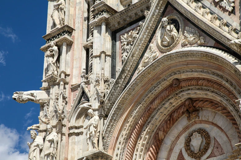 an ornate building is pictured against the blue sky