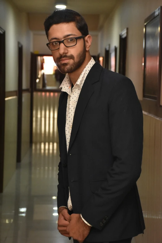 a man is standing on a tile floor