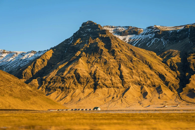 two mountain peaks with snow on them