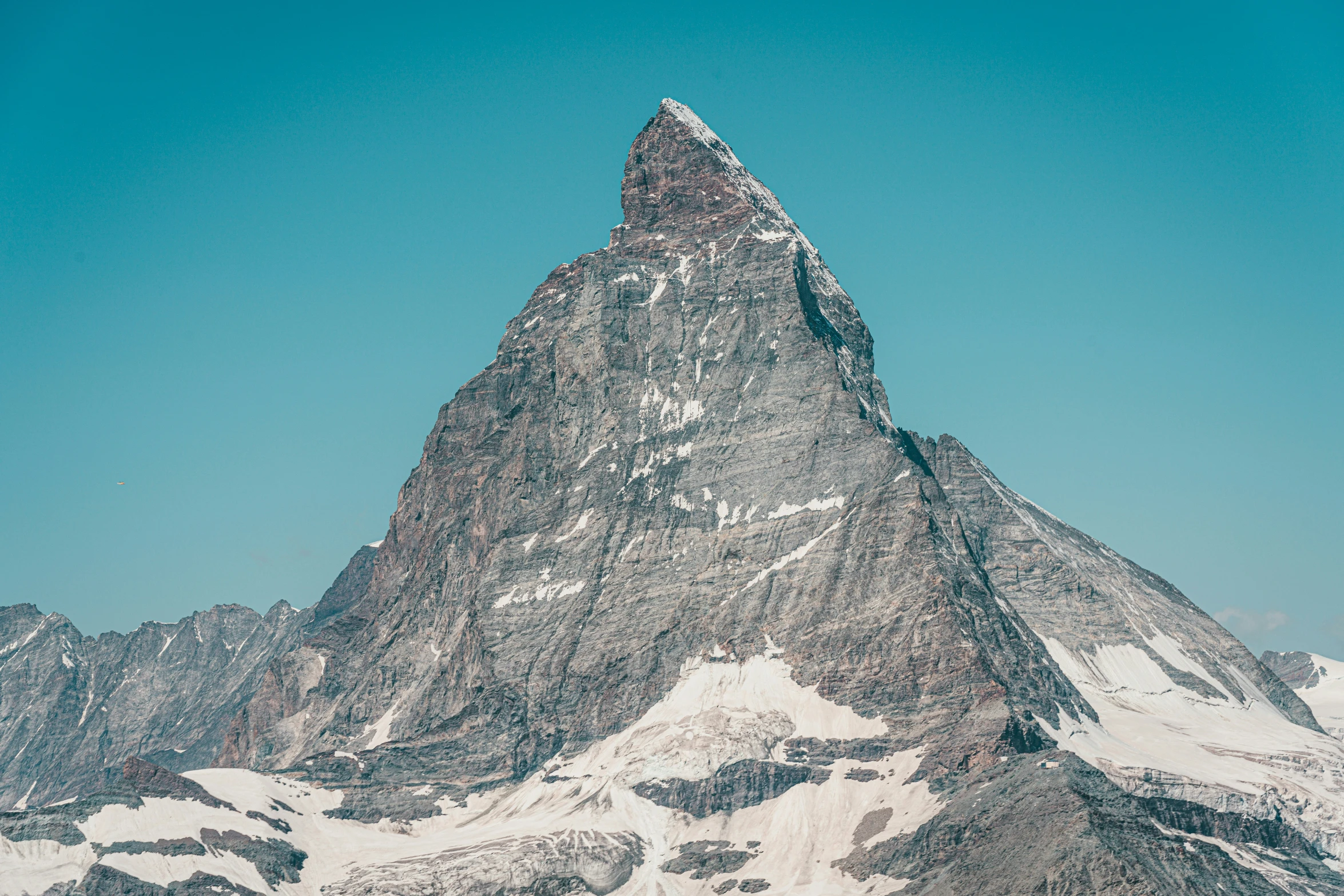 a large mountain with a snow covered top