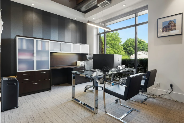 modern office setting in modern building with desks and chairs