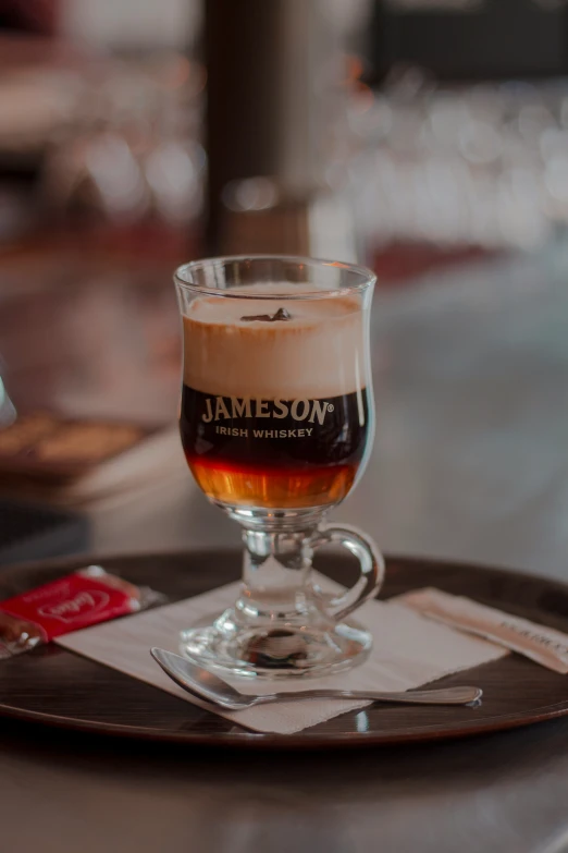 the drink is presented on a saucer on a plate