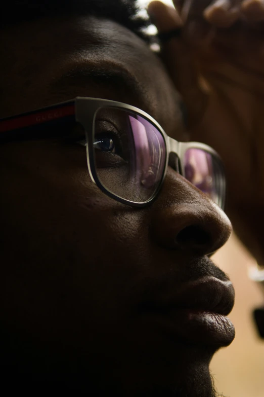 a close up of a person wearing glasses