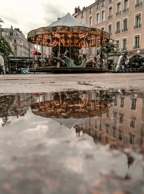 a carousel on a small street in a city