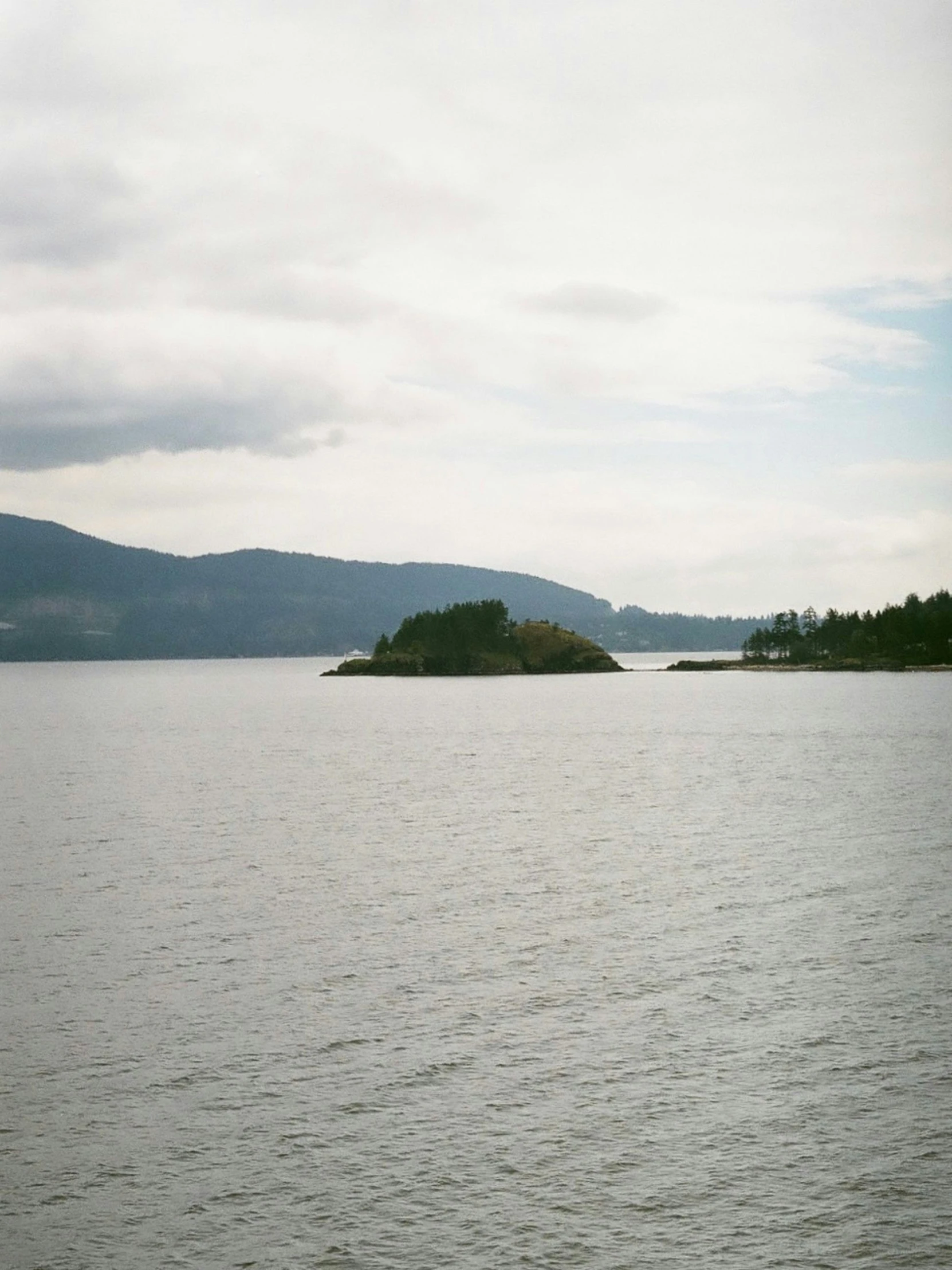 an island that is sitting in the middle of some water