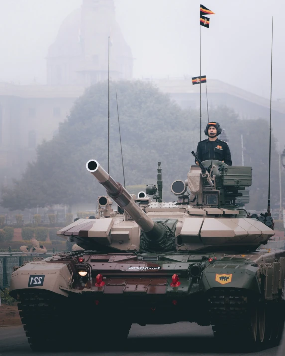 a tanks is parked in the middle of the street