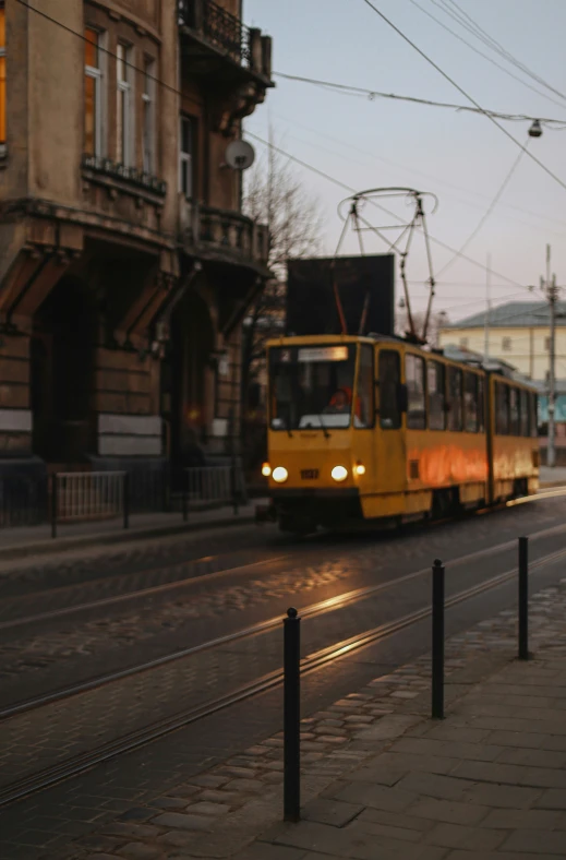 the city trolley is making its way down the road