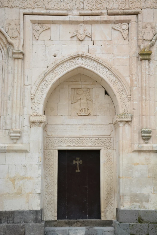 a doorway into a wall that is made out of brick