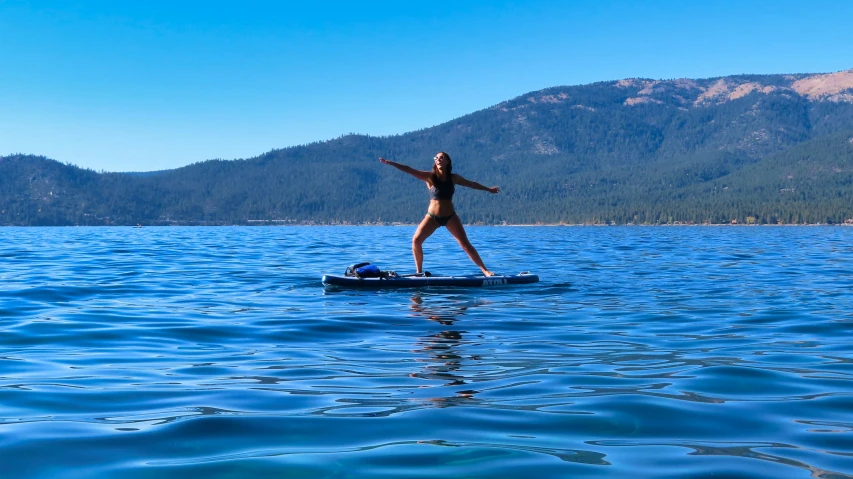 a woman on a paddle board in the water