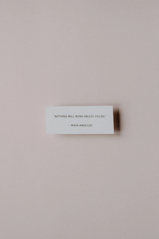 a small card is laying on the wall