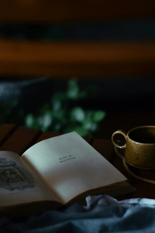 a book and a cup on a table