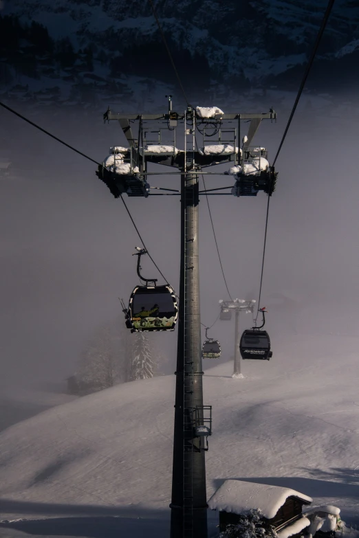 two ski lift cars on the snowy mountain