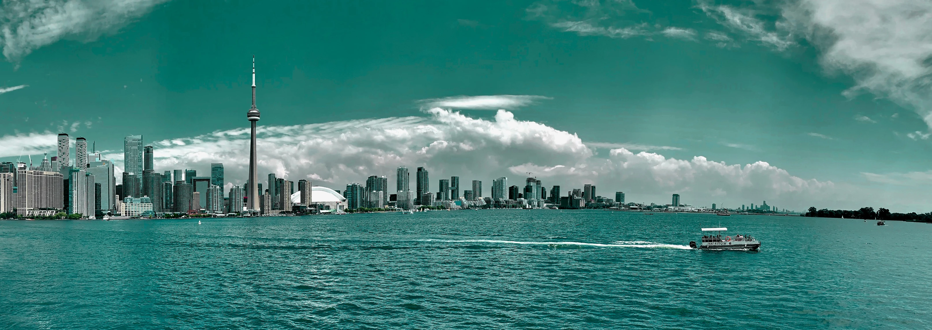 the city of a large lake is next to a very tall building